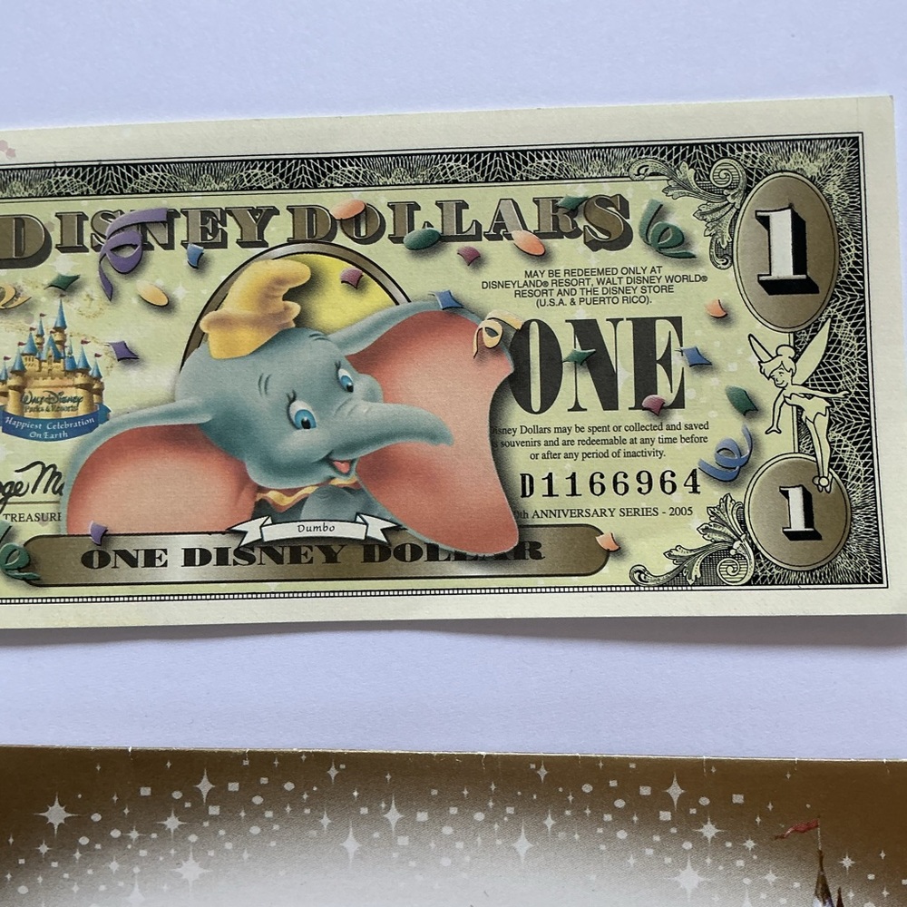 ONE VERY VERY RARE 2005 MINT
DISNEYLAND DISNEY DOLLAR
